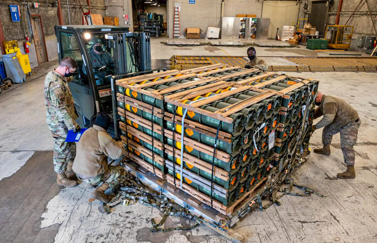 Airmen and civilians from the 436th Aerial Port Squadron palletize military equipment bound for Ukraine during a foreign military sales mission at Dover Air Force Base, in Delaware, on Jan. 21, 2022. (U.S. Air Force/Mauricio Campino/Handout via Reuters)