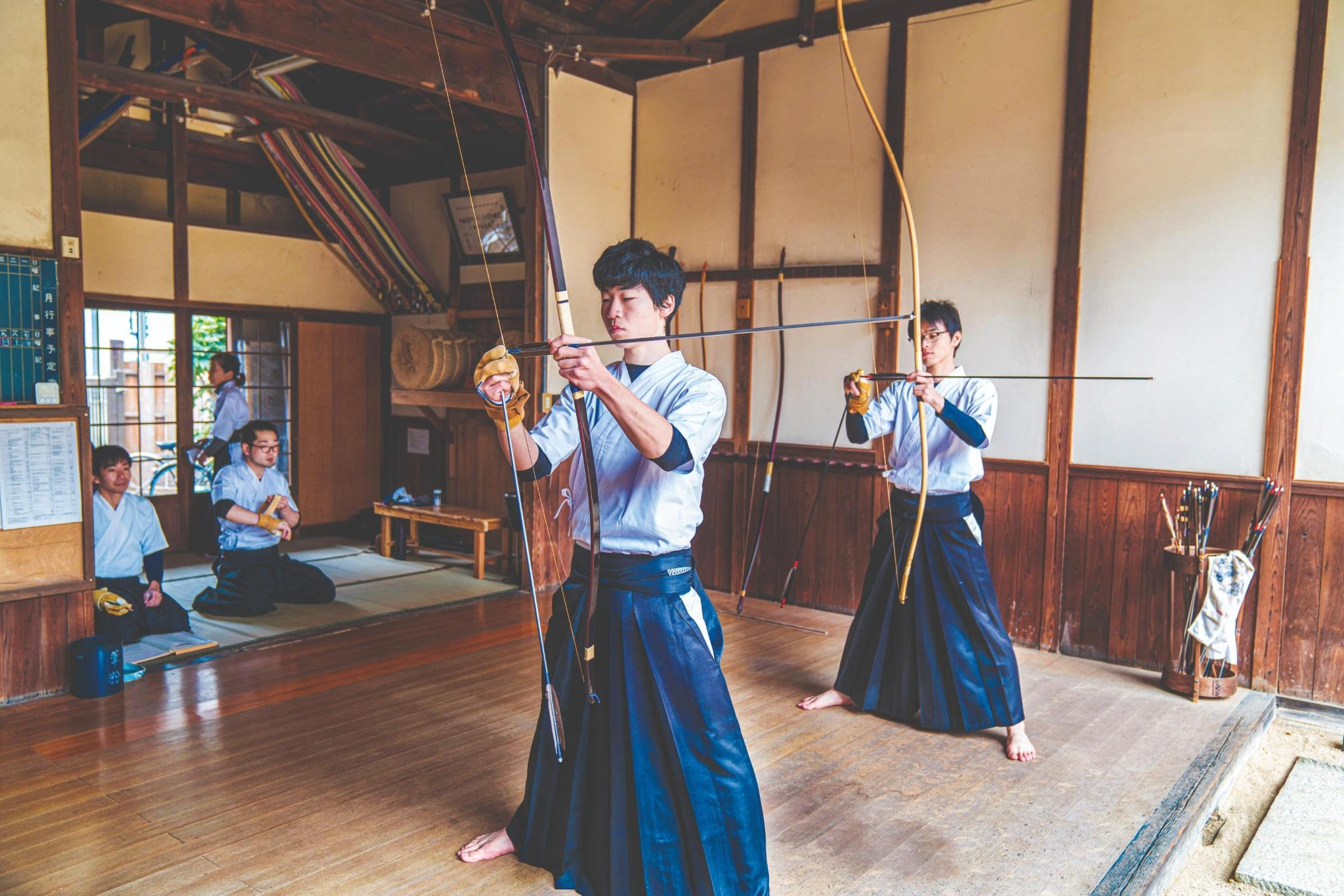 Traditional Japanese archers prepare their bows