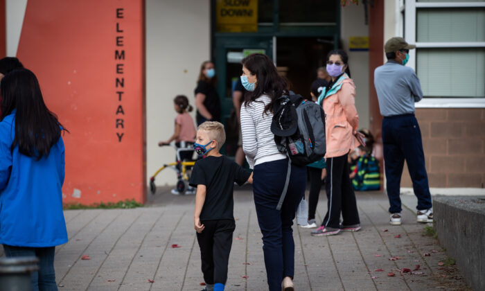 Parents drop off their children at a school in Vancouver on Sept. 9, 2021.  (The Canadian Press/Darryl Dyck)