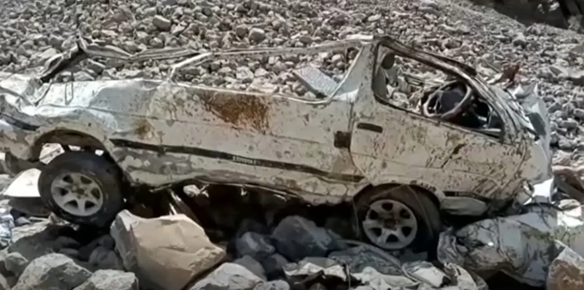 The wreckage of a minibus after it veered off a narrow mountain road and plummeted into a ravine, in Qilla Saifullah, a district in Pakistan's southwest Baluchistan province, on June 8, 2022, in a still from video. (AP/Screenshot via The Epoch Times)