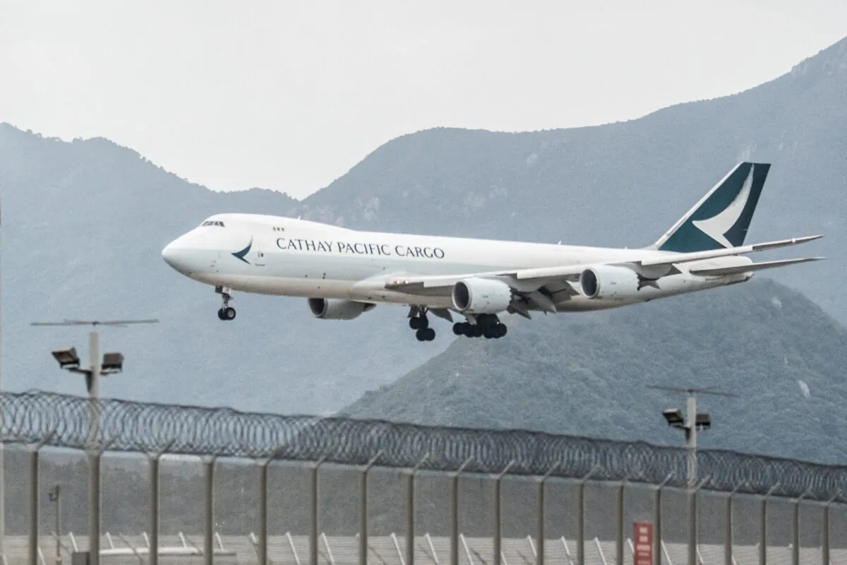 A Cathay Pacific cargo airplane prepares to land at Hong Kong International Airport on Nov. 21, 2021. (Bertha Wang/AFP via Getty Images)