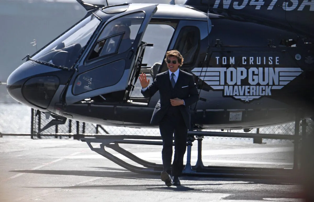 Actor Tom Cruise arrives in a helicopter to the world premiere of "Top Gun: Maverick" aboard the USS Midway in San Diego on May 4, 2022. (Robyn Beck/AFP via Getty Images)