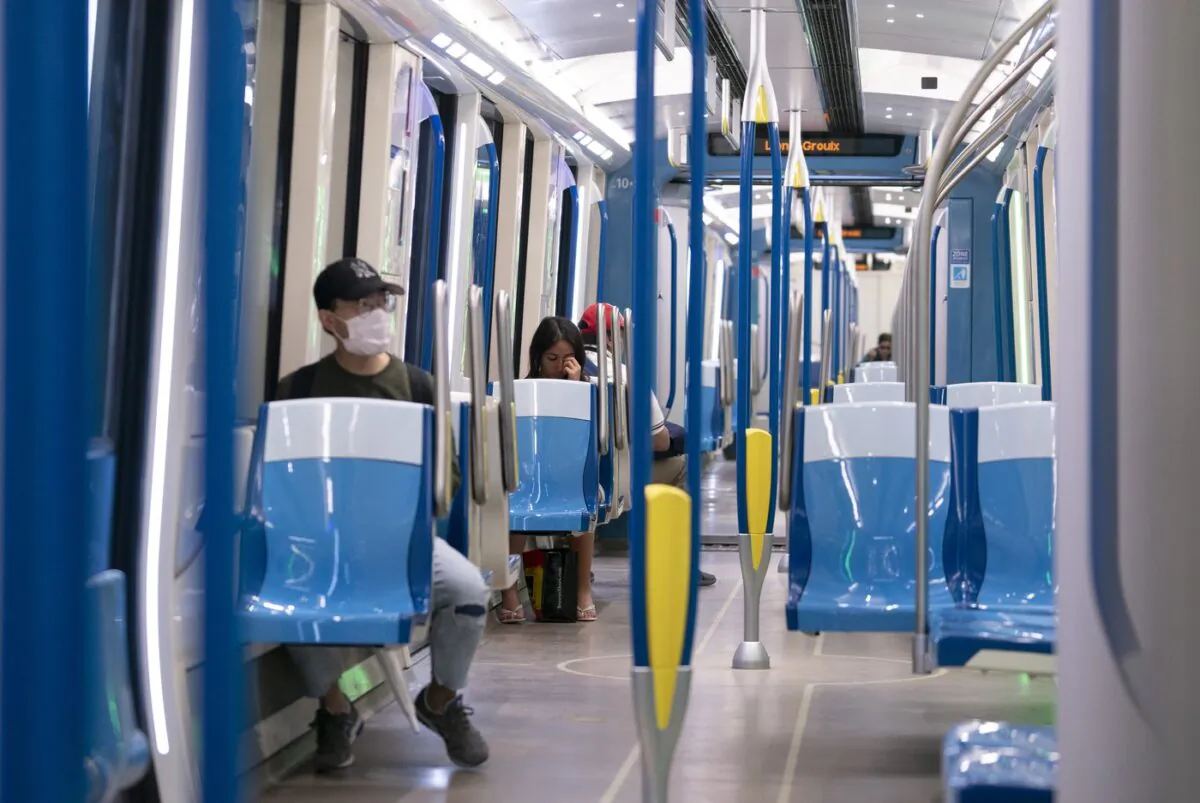 Commuters ride a near-empty subway train in Montreal, on May 25, 2020. (The Canadian Press/Paul Chiasson)
