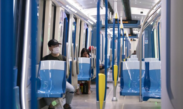 Commuters ride a near-empty subway train in Montreal, on May 25, 2020. (The Canadian Press/Paul Chiasson)