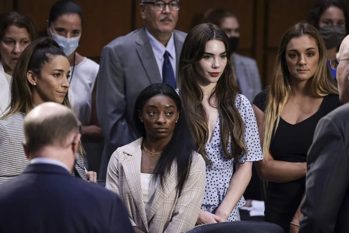 (L-R) U.S. Olympic Gymnasts Aly Raisman, Simone Biles, McKayla Maroney, and NCAA and world champion gymnast Maggie Nichols in Washington on Sept. 15, 2021. (Anna Moneymaker/Getty Images)