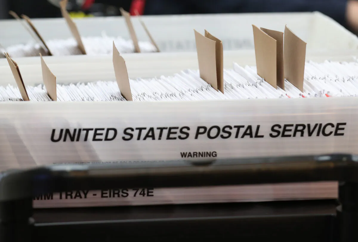 Boxes for Vote-by-Mail ballots that need to be reviewed due to signature discrepancies, as the Miami-Dade County Canvassing Board convenes ahead of the November 3rd general election at the Miami-Dade County Elections Department in Doral, Fla., on Oct. 15, 2020. (Joe Raedle/Getty Images)