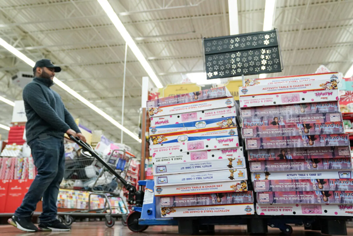 A Walmart employee stocks the toy section of Walmart on Black Friday, in King of Prussia, Pa., on Nov. 29, 2019. (Sarah Silbiger/Reuters)