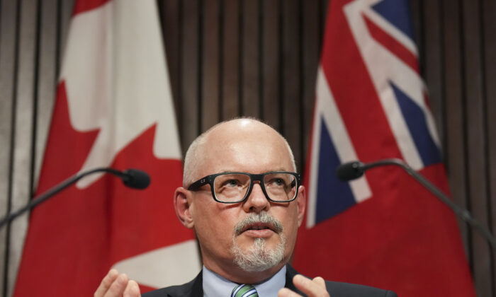 Dr. Kieran Moore, Chief Medical Officer of Ontario, speaks during a COVID-19 pandemic press conference in Queens Park, Toronto, April 11, 2022.  (The Canadian Press/Nathan Denette)
