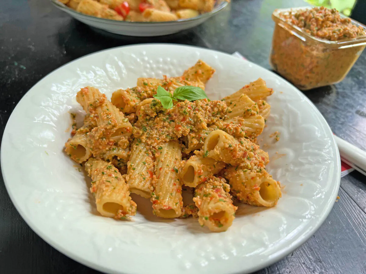 Pesto made with fresh tomatoes, lots of Parmesan and olive oil flavored with chili peppers makes for an easy pasta sauce in summer. (Gretchen McKay/Pittsburgh Post-Gazette/TNS)