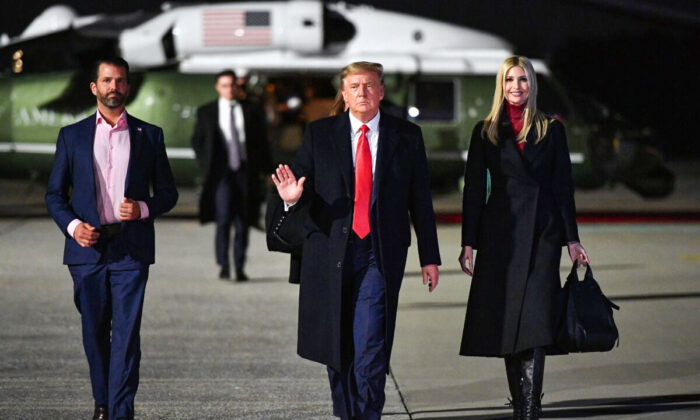 U.S. President Donald Trump, daughter Ivanka Trump, and son Donald Trump Jr., make their way to board Air Force One before departing from Dobbins Air Reserve Base in Marietta, Ga., on Jan. 4, 2021. (Mandel Ngan/AFP via Getty Images)