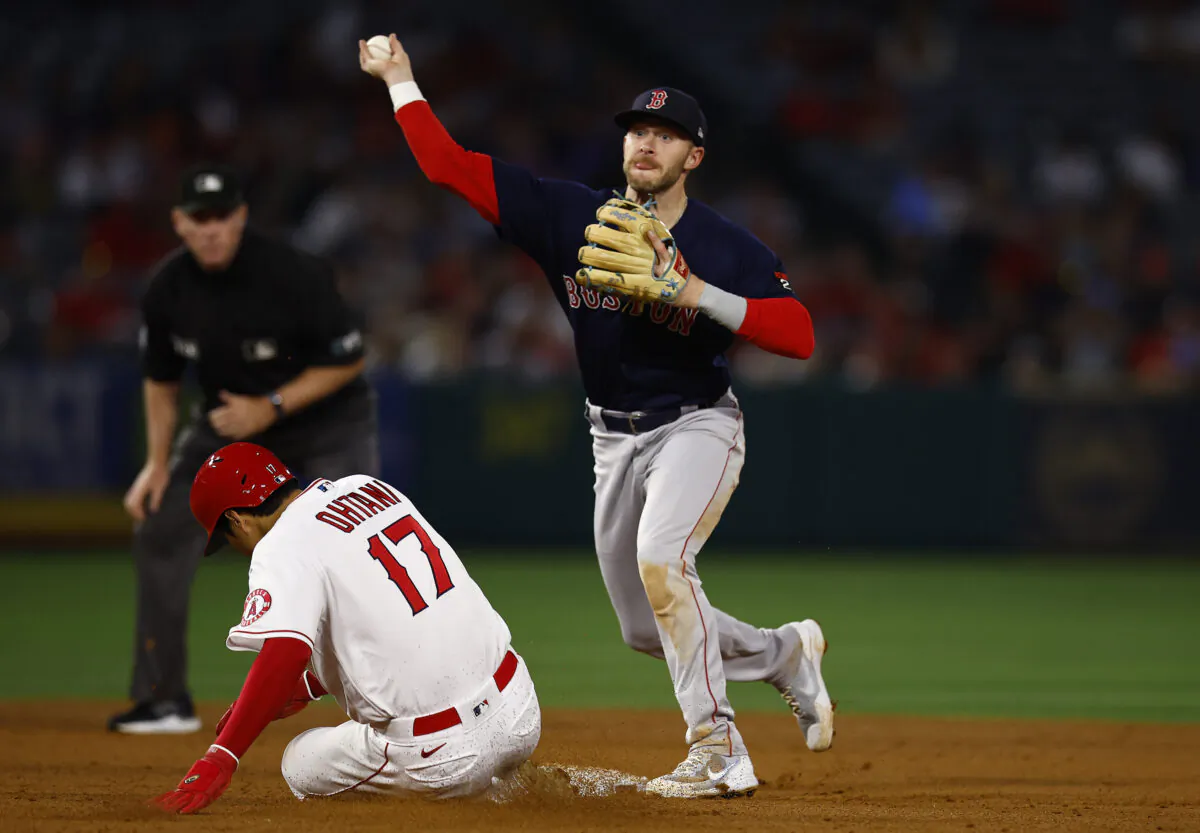 Trevor Story #10 of the Boston Red Sox makes the out against Shohei Ohtani #17 of the Los Angeles Angels in the fifth inning at Angel Stadium in Anaheim, Calif. on June 8, 2022. (Ronald Martinez/Getty Images)