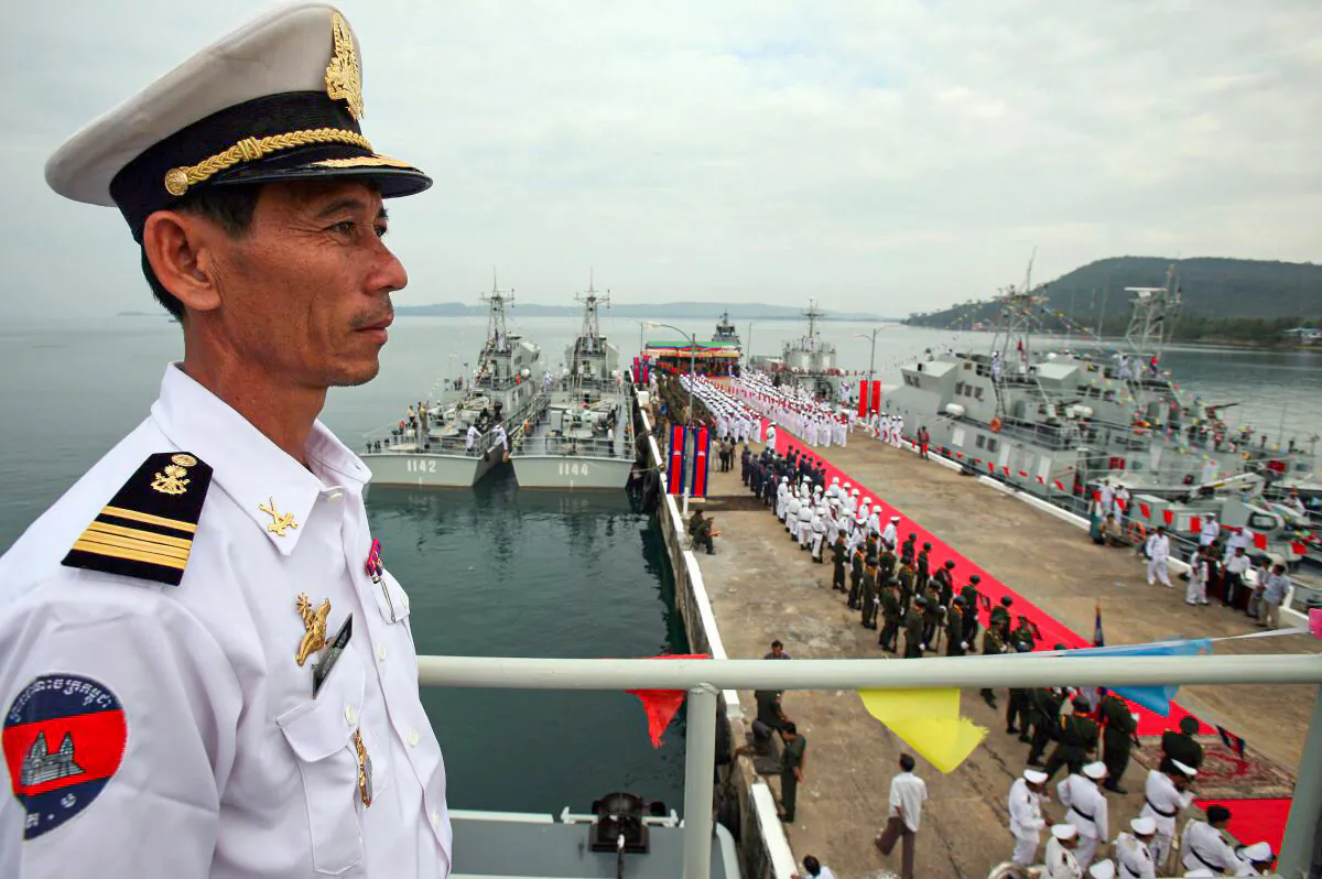 A Cambodian naval personnel stands on a naval patrol boat during a ceremony for nine naval patrol boats that were donated by China, at the Cambodia Naval Base in Sihanoukville, some 220 kilometers south-west of Phnom Penh, on 07 November 2007. (TANG CHHIN SOTHY/AFP/Getty Images)