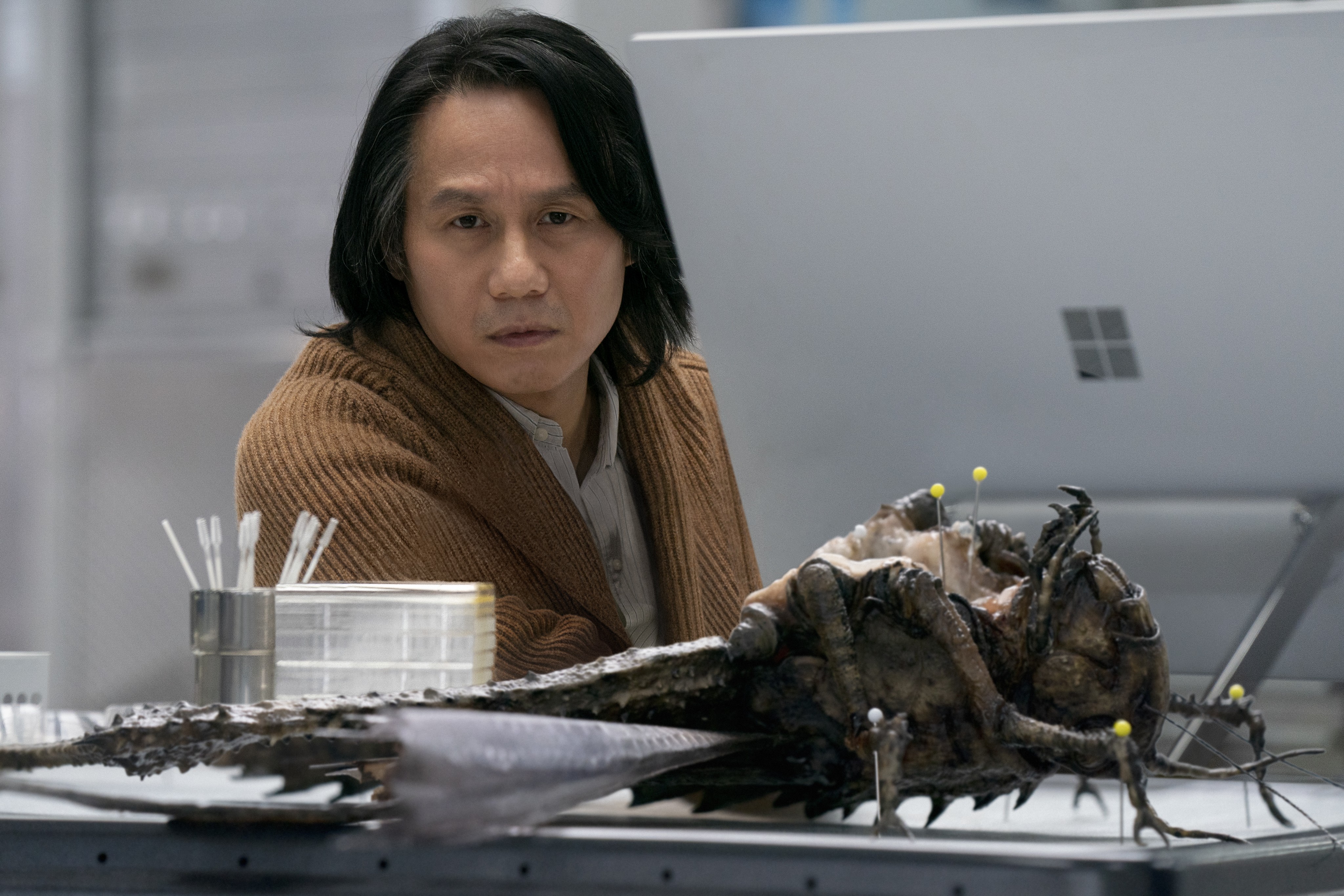 man and giant bug in Jurassic World: Dominion