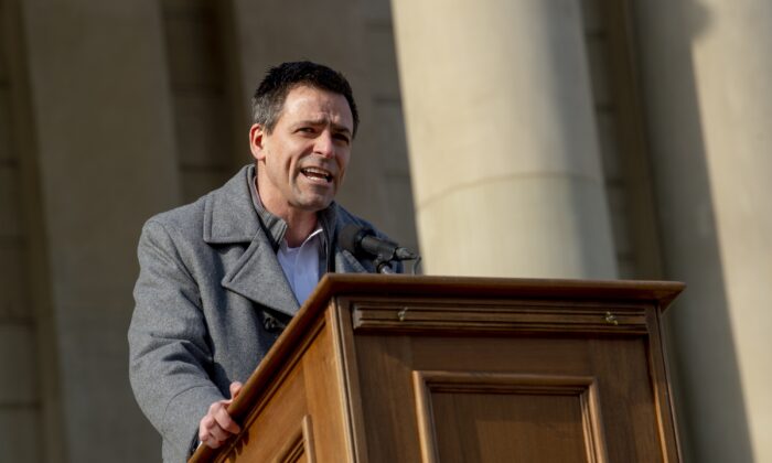 Ryan Kelley, a Republican gubernatorial candidate, speaks to conservative activists outside the Michigan Capitol in Lansing, Mich., on Feb. 8, 2022. (Jake May/The Flint Journal via AP)