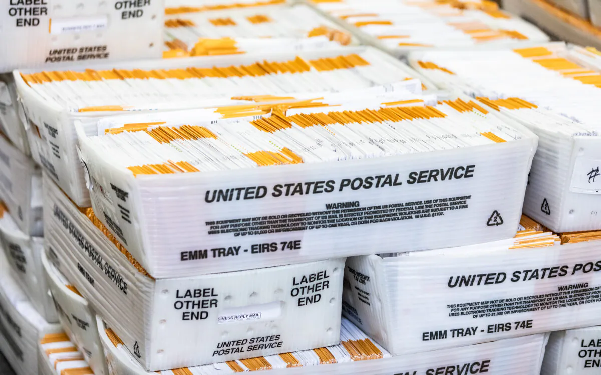 Voting ballots move forward in the audit process at the Orange County Registrar of Voters office in Santa Ana, Calif., on June 9, 2022. (John Fredricks/The Epoch Times)