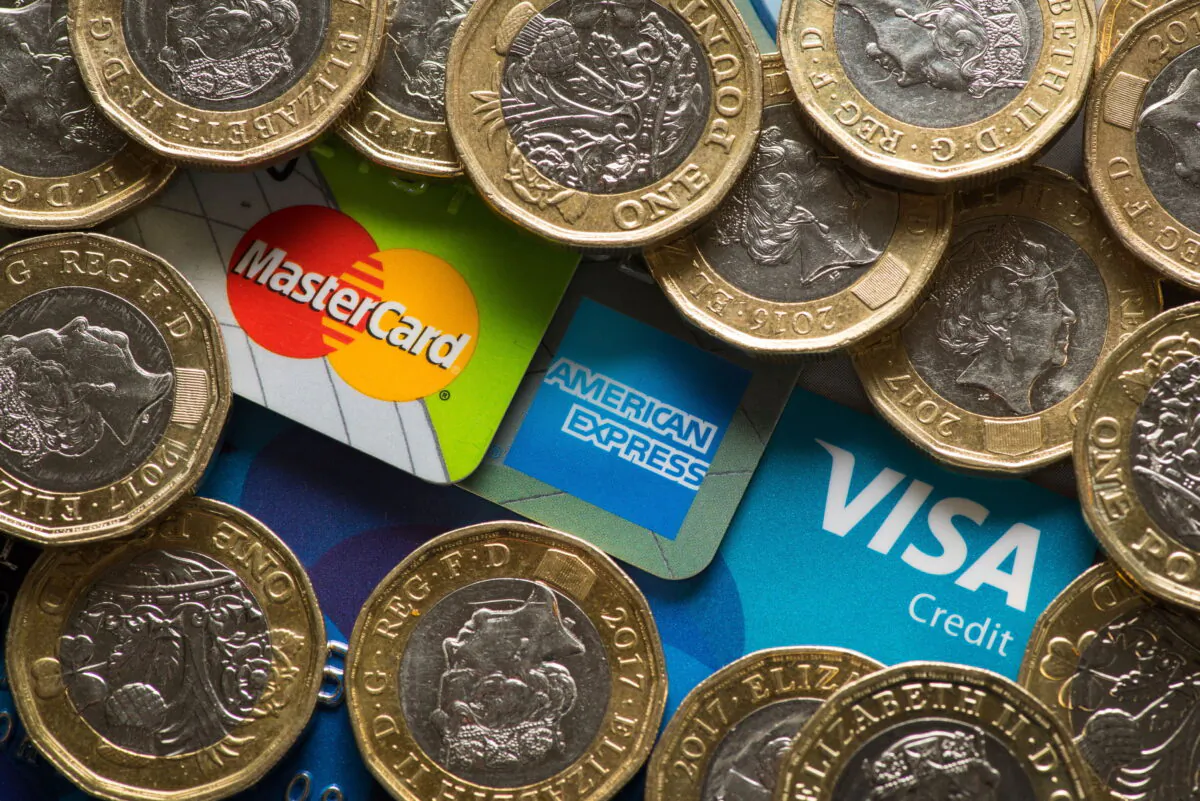Coins and credit cards on a table in this undated photo. (Dominic Lipinski/PA)