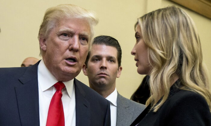 Donald Trump, left, his son Donald Trump Jr., center, and his daughter Ivanka Trump speak during the unveiling of the design for the Trump International Hotel in the The Old Post Office, in Washington, on  Sept. 10, 2013. (Manuel Balce Ceneta/AP Photo, File)