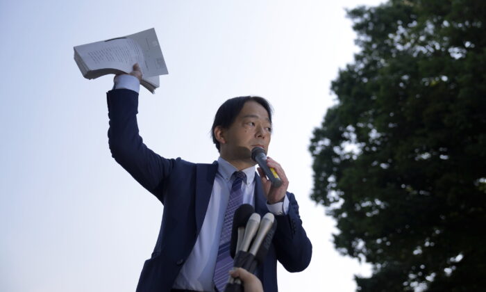 Izutaro Managi, a lawyer for the plaintiffs, speaks to plaintiffs and their supporters after hearing the decision of the Tokyo Supreme Court in Tokyo on June 17, 2022. (Eugene Hoshiko/AP Photo)