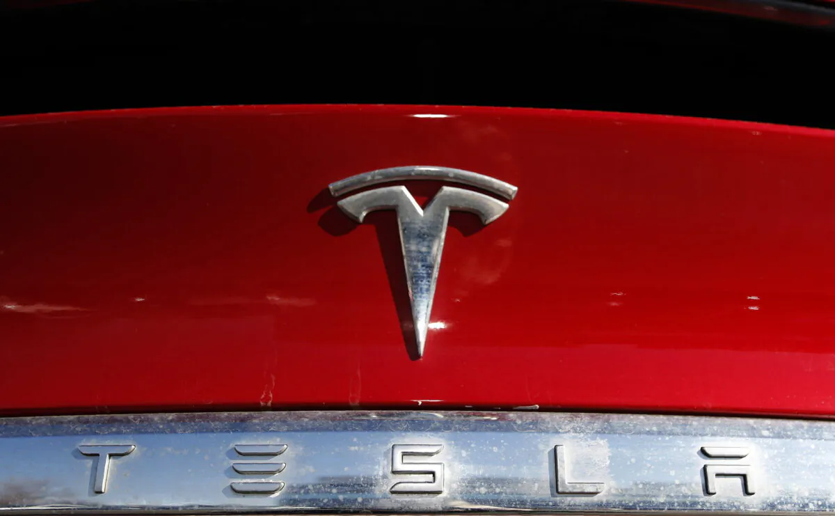 The Tesla company logo sits on a vehicle at a Tesla dealership in Littleton, Colo., on Feb. 2, 2020. (David Zalubowski/AP Photo)