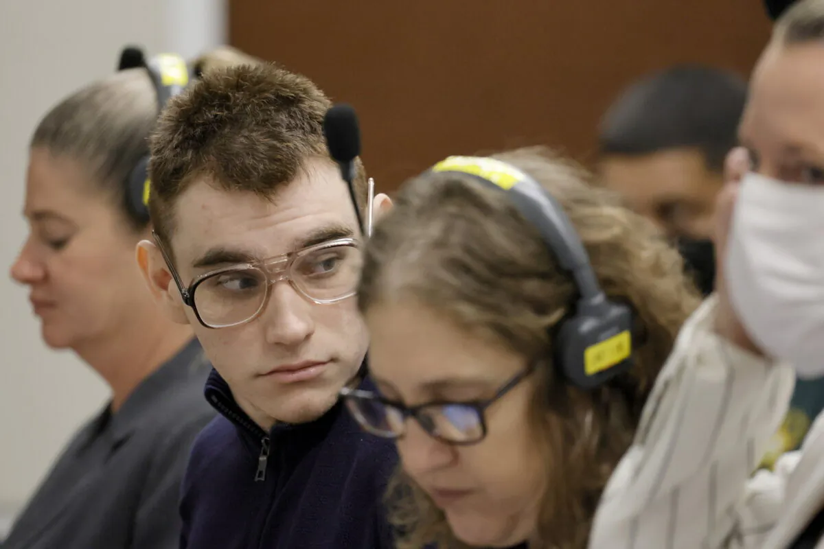 Marjory Stoneman Douglas High School shooter Nikolas Cruz stands as prospective jurors enter the courtroom for jury selection in the penalty phase of Cruz's trial at the Broward County Courthouse in Fort Lauderdale, Fla., on June 22, 2022. (Amy Beth Bennett/South Florida Sun Sentinel via AP, Pool)