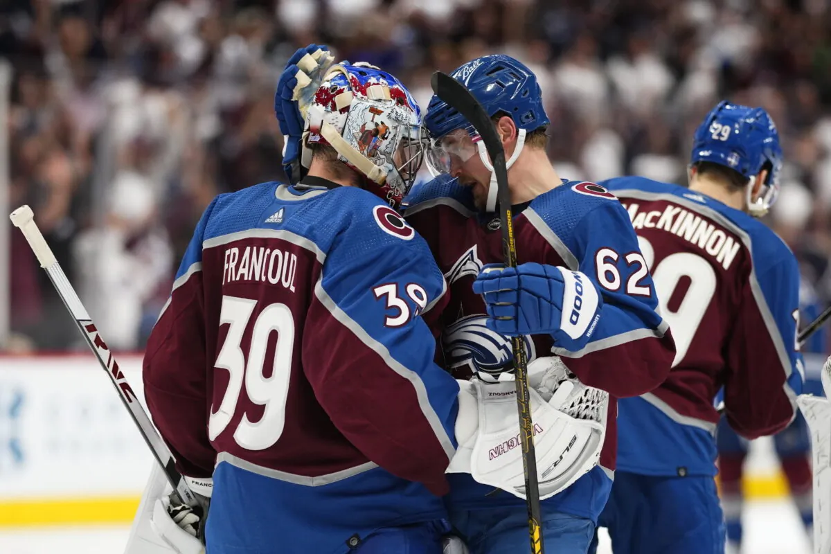 Colorado Avalanche left wing Artturi Lehkonen (62) celebrates the team's 4-0 win against the Edmonton Oilers with goaltender Pavel Francouz (39) following Game 2 of the NHL hockey Stanley Cup playoffs Western Conference finals in Denver, on June 2, 2022. (Jack Dempsey/AP Photo)
