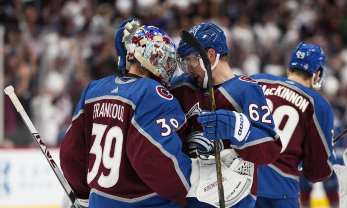 Colorado Avalanche left wing Artturi Lehkonen (62) celebrates the team's 4-0 win against the Edmonton Oilers with goaltender Pavel Francouz (39) following Game 2 of the NHL hockey Stanley Cup playoffs Western Conference finals in Denver, on June 2, 2022. (Jack Dempsey/AP Photo)