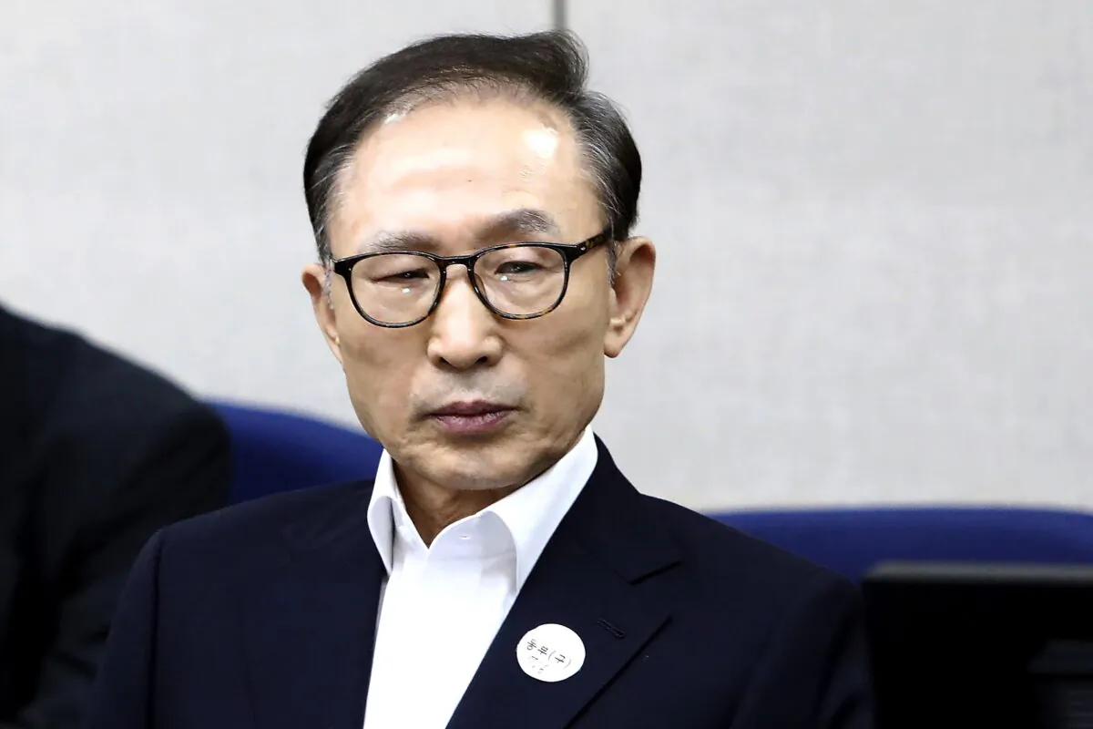 Former South Korean President Lee Myung-bak appears for his first trial at the Seoul Central District Court in Seoul, South Korea, on March 23, 2018. (Chung Sung-Jun/Pool Photo via AP)