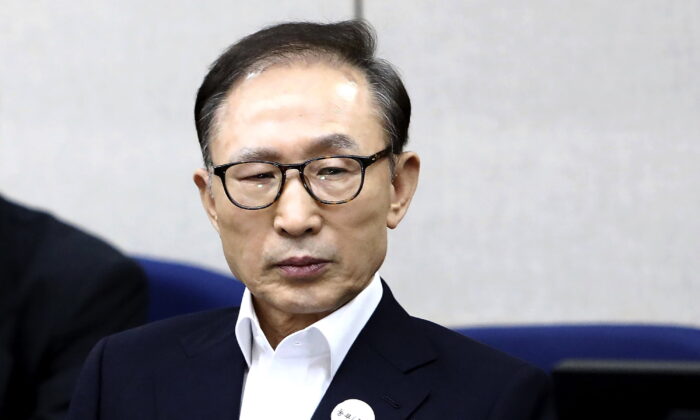Former South Korean President Lee Myung-bak appears for his first trial at the Seoul Central District Court in Seoul, South Korea, on March 23, 2018. (Chung Sung-Jun/Pool Photo via AP)