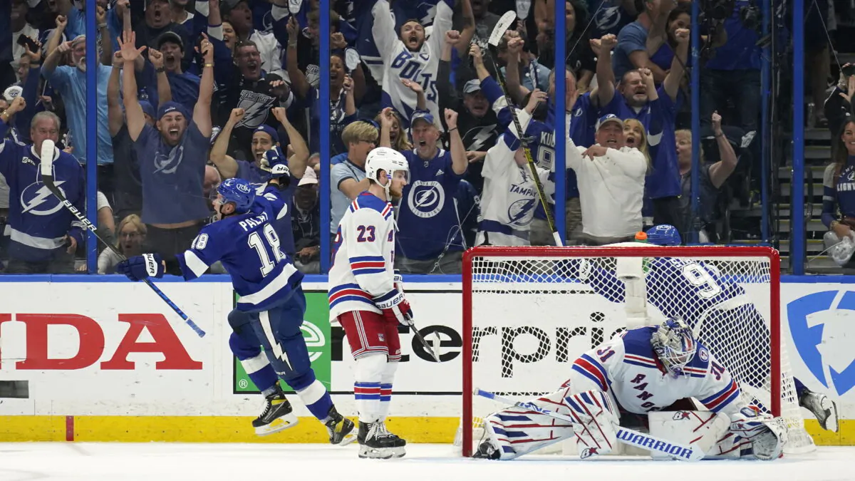 Tampa Bay Lightning left wing Ondrej Palat (18) reacts after scoring past New York Rangers goaltender Igor Shesterkin (31) during the third period in Game 3 of the NHL hockey Stanley Cup playoffs Eastern Conference finals in Tampa, Fla., on June 5, 2022. (Chris O'Meara/AP Photo)