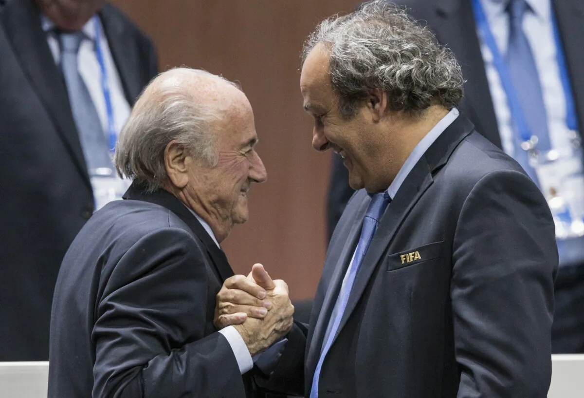 FIFA president Sepp Blatter (L), is greeted by UEFA President Michel Platini after Blatter's re-election as president at the Hallenstadion in Zurich, Switzerland, on May 29, 2015. (Patrick B. Kraemer/Keystone via AP)