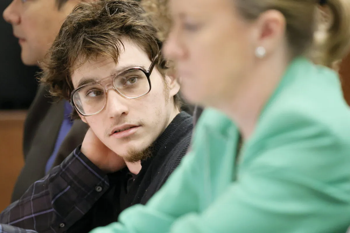 Marjory Stoneman Douglas High School shooter Nikolas Cruz glances at Assistant Public Defender Melisa McNeill during jury selection in the penalty phase of his trial at the Broward County Courthouse in Fort Lauderdale, Fla., on June 6, 2022. (Amy Beth Bennett/South Florida Sun Sentinel via AP, Pool)