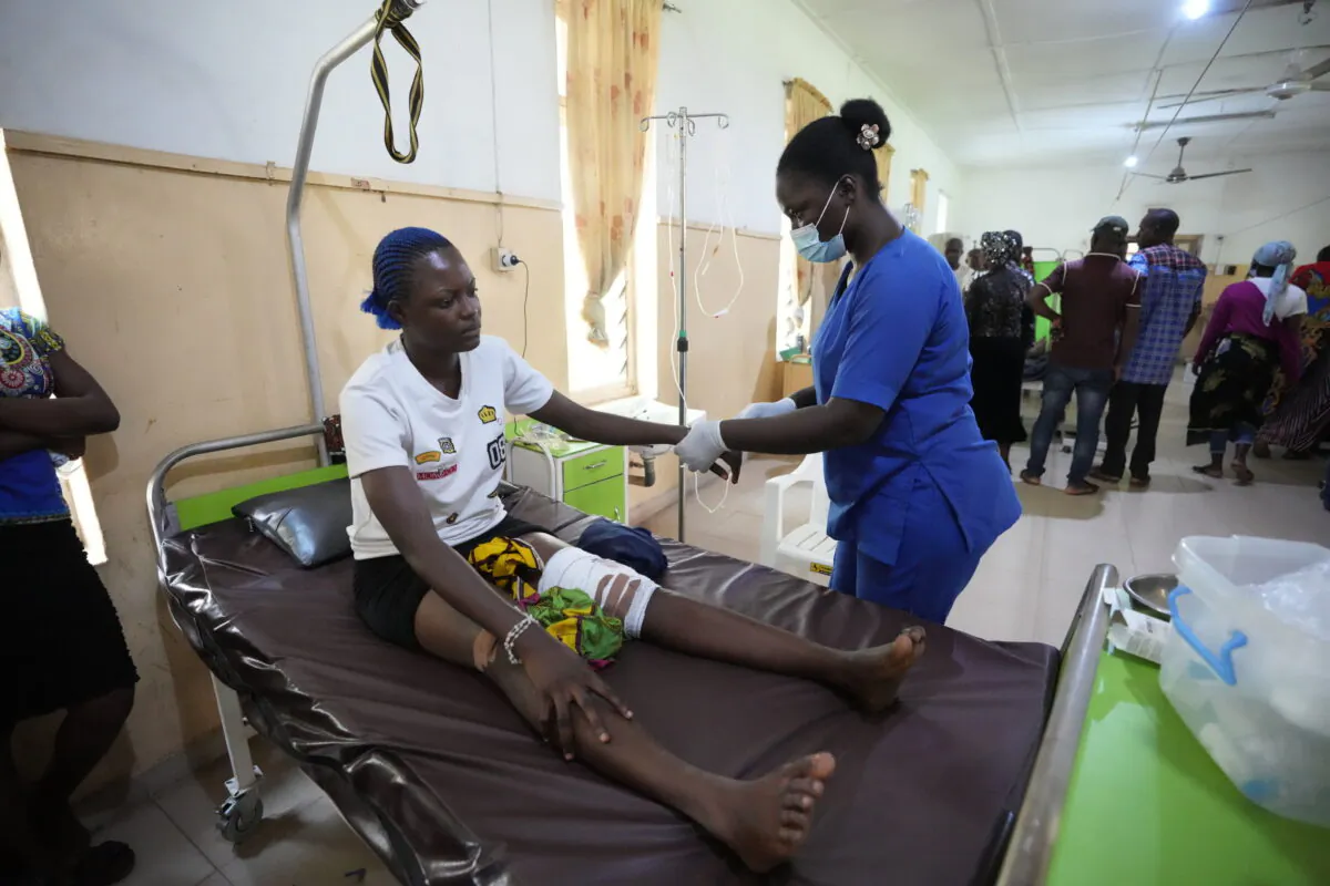 A victim of the St. Francis Catholic Church attack receives treatment at St Louis Catholic Hospital in Owo, Nigeria, Monday, June 6, 2022. (AP Photo)