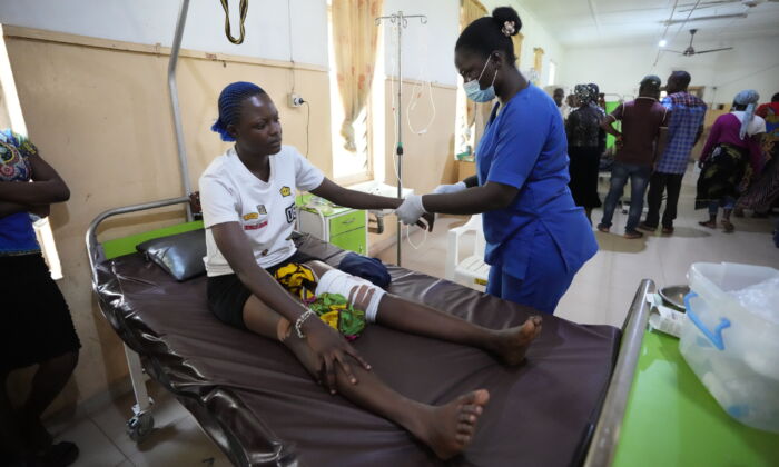 A victim of the St. Francis Catholic Church attack receives treatment at St Louis Catholic Hospital in Owo, Nigeria, Monday, June 6, 2022. (AP Photo)