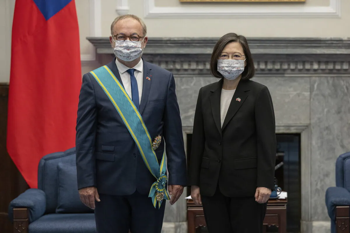 Taiwanese President Tsai Ing-wen (R) pose with French Senator Joel Guerriau (L) during a visit at the Presidential Office in Taipei, Taiwan on June 9, 2022. (Taiwan Presidential Office via AP)