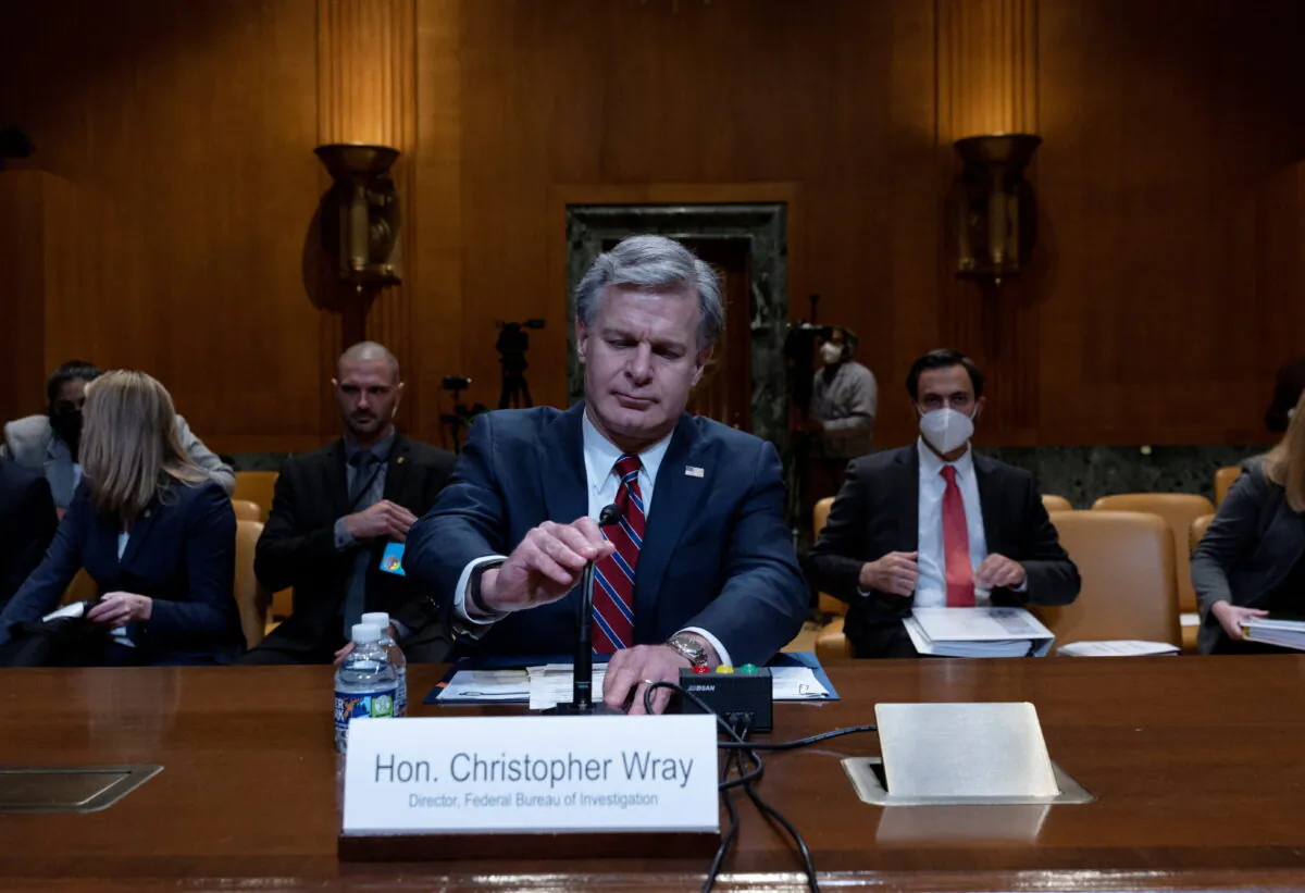 Federal Bureau of Investigation Director Christopher Wray prepares to testify in a hearing on the FY 2023 budget for the FBI held by the Commerce, Justice, Science, and Related Agencies Subcommittee on Capitol Hill in Washington on May 25, 2022. (Leah Millis/Reuters)