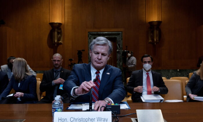 Federal Bureau of Investigation Director Christopher Wray prepares to testify in a hearing on the FY 2023 budget for the FBI held by the Commerce, Justice, Science, and Related Agencies Subcommittee on Capitol Hill in Washington on May 25, 2022. (Leah Millis/Reuters)