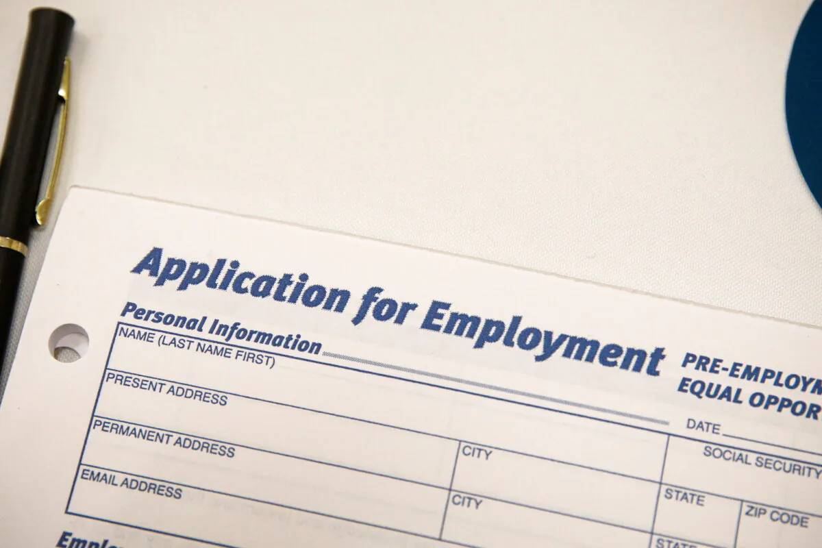 An employment application form is displayed during a restaurant job career fair organized by the industry group High Road Restaurants in New York City on May 13, 2021. (Brendan McDermid/Reuters)