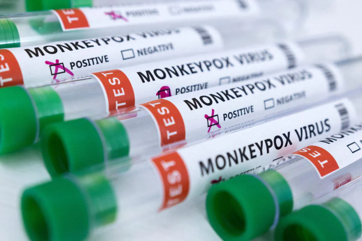Test tubes labelled "Monkeypox virus positive and negative" in a photo illustration taken on May 23, 2022. (Dado Ruvic/Reuters)