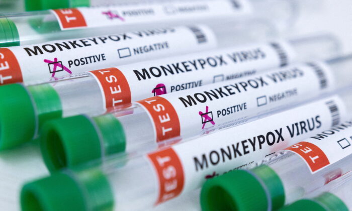 Test tubes labelled "Monkeypox virus positive and negative" in a photo illustration taken on May 23, 2022. (Dado Ruvic/Reuters)