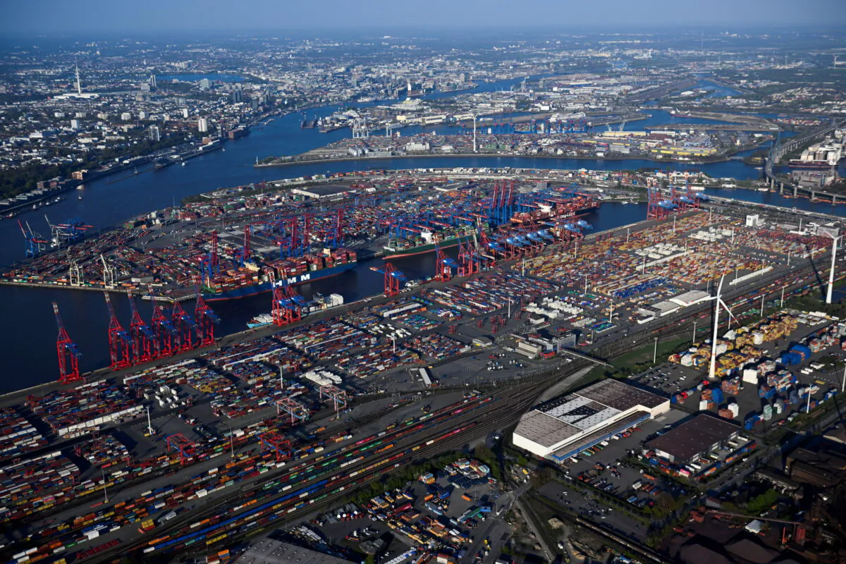 Cargo ships are loaded at a container terminal in a harbor in Hamburg, Germany, on April 27, 2022. (Fabian Bimmer/Reuters)