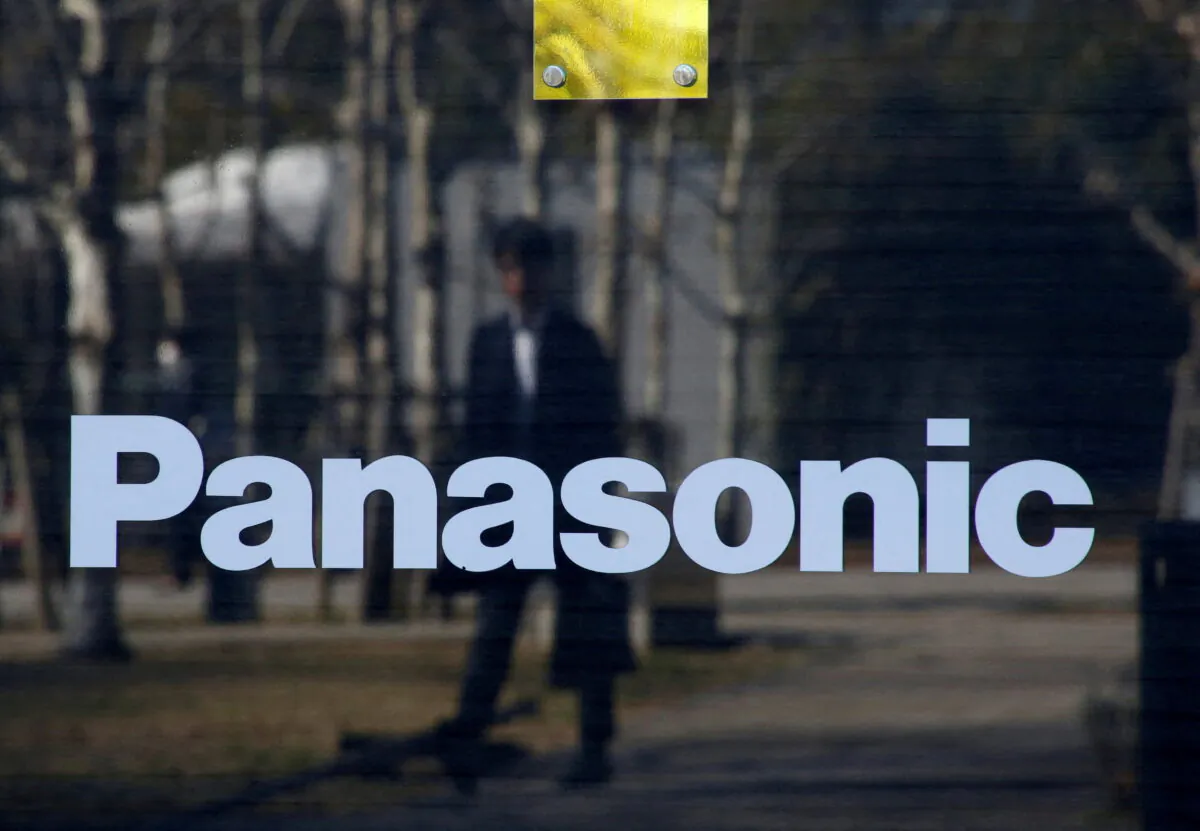 A man is reflected on Panasonic's logo at the Panasonic Center in Tokyo on Feb. 2, 2017. (Kim Kyung-Hoon/Reuters)