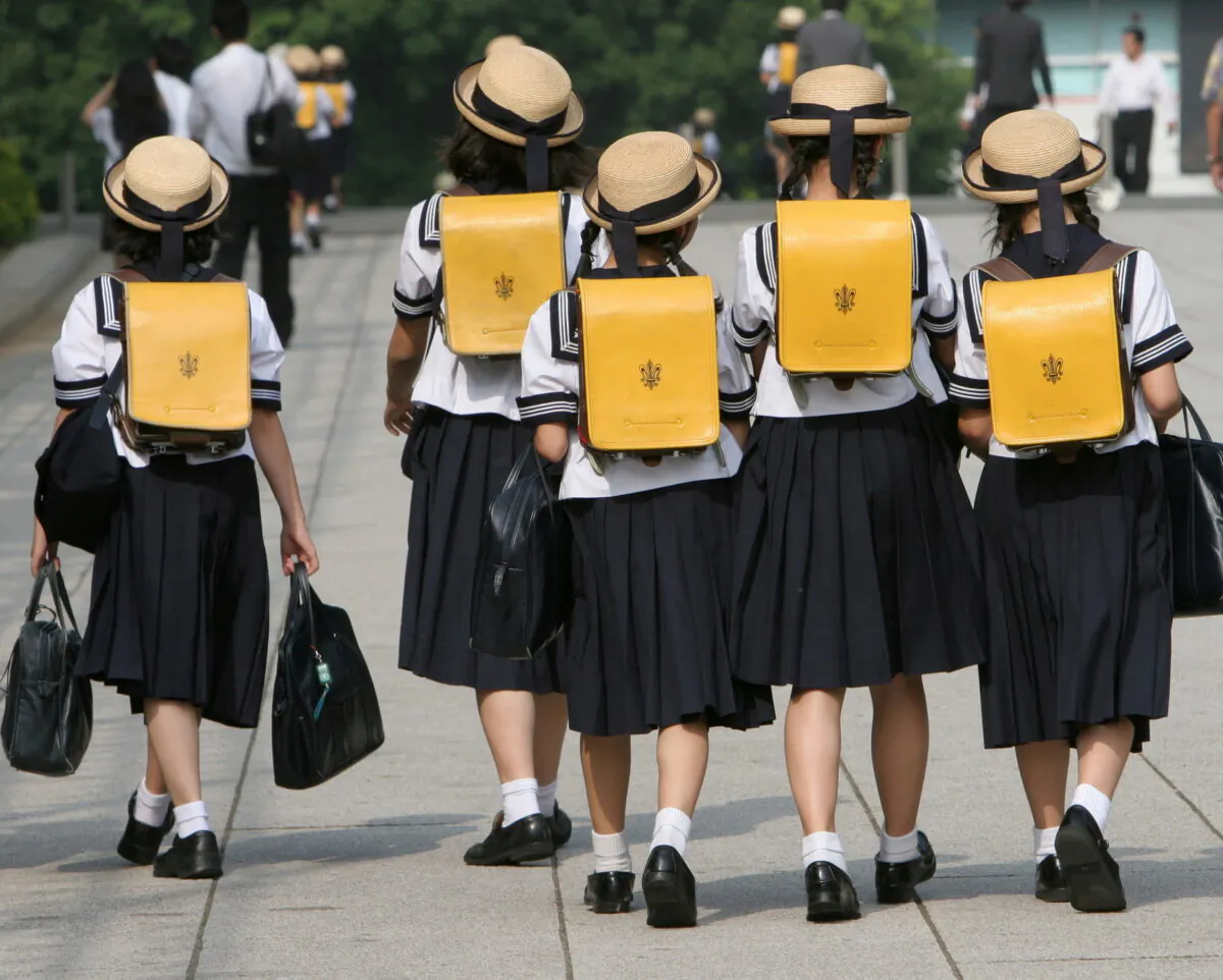 Children walk on their way back from school in Tokyo, Japan, on June 30, 2006. (Toshiyuki Aizawa/Reuters)