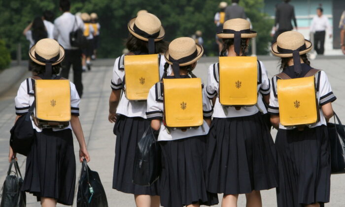 Children walk on their way back from school in Tokyo, Japan, on June 30, 2006. (Toshiyuki Aizawa/Reuters)