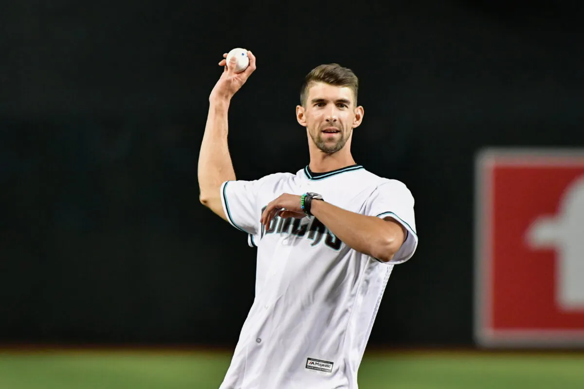 Olympic Gold Medal swimmer Michael Phelps throws a ceremonial first pitch prior to the game between the Arizona Diamondbacks and the Colorado Rockies at Chase Field in Phoenix on Aug. 29, 2019. (Matt Kartozian/USA TODAY Sports via Reuters)