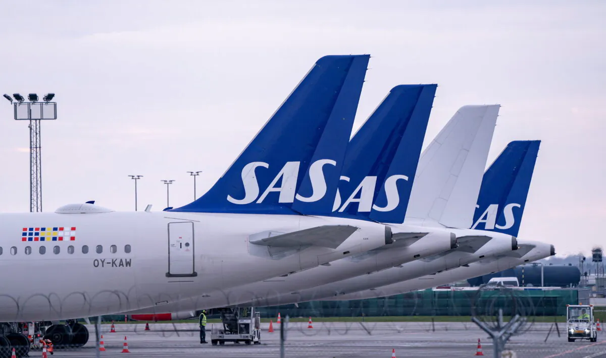Scandinavian Airlines (SAS) Airbus A320 planes are parked at Copenhagen airport in Kastrup, Denmark, on March 15, 2020. (TT News Agency/Johan Nilsson via Reuters)