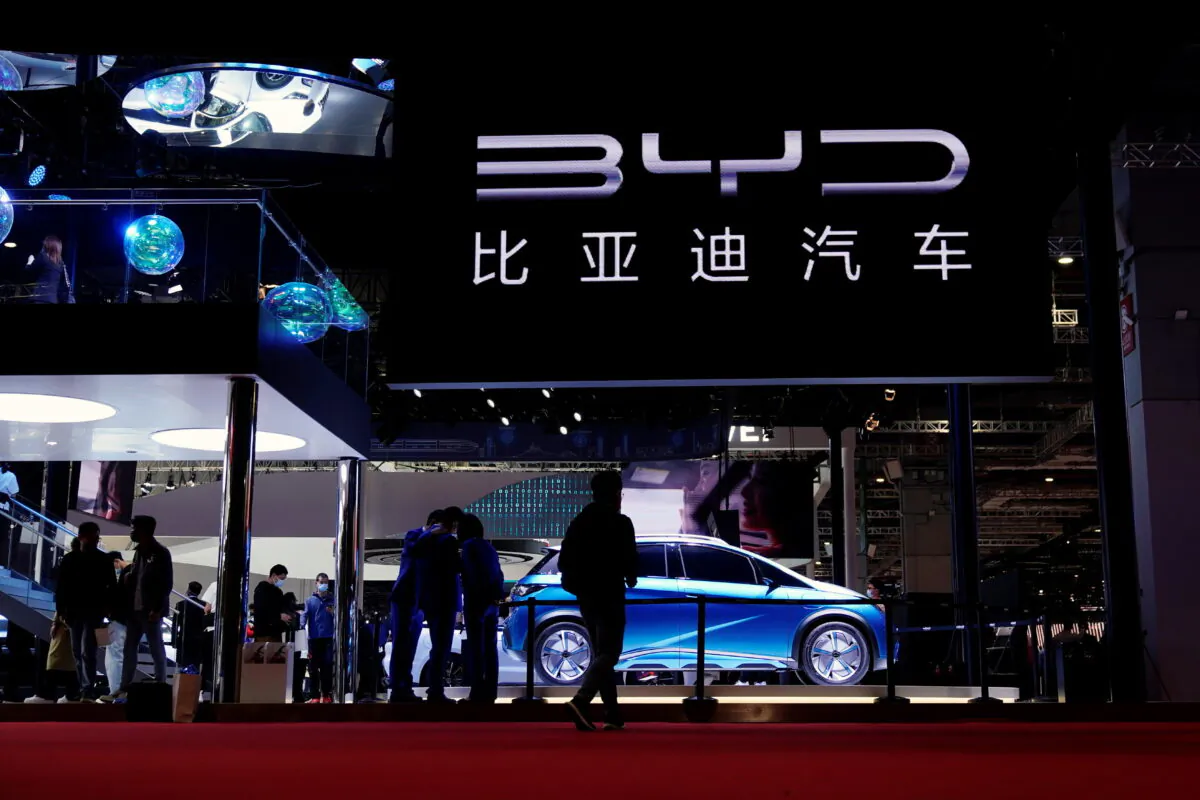 People visit the BYD booth during a media day for the Auto Shanghai show in Shanghai, China, on April 19, 2021. (Aly Song/Reuters)