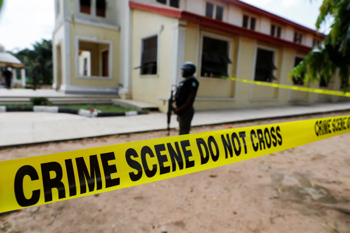 Police crime scene tape in front of St. Francis Catholic Church where gunmen attacked worshippers during a Sunday mass service in Owo, Ondo, Nigeria, on June 6, 2022. (Temilade Adelaja/Reuters)