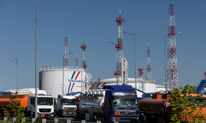 Petrol trucks are parked near oil tanks at Volodarskaya LPDS production facility owned by Transneft oil pipeline operator in the village of Konstantinovo in the Moscow region, Russia, on June 8, 2022. (Maxim Shemetov/Reuters)