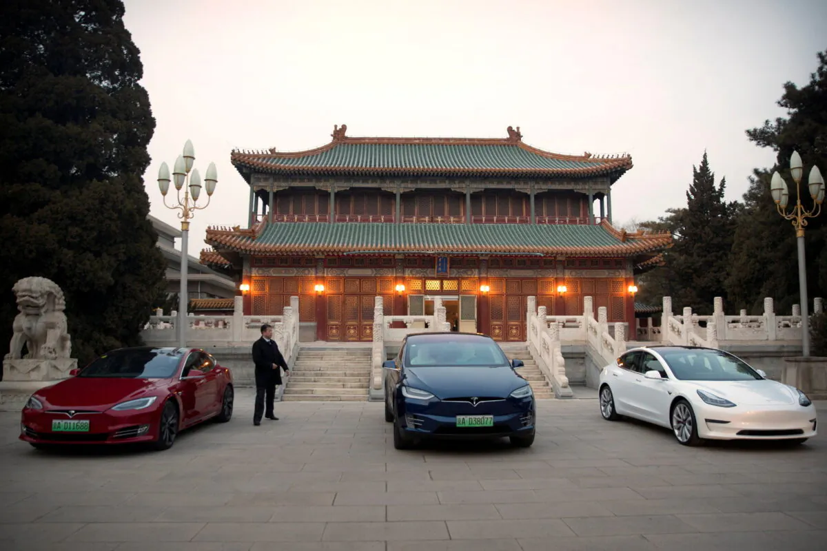 Tesla vehicles are parked outside a building at the Zhongnanhai leadership compound in Beijing on January 9, 2019. (Mark Schiefelbein/Pool via Reuters)