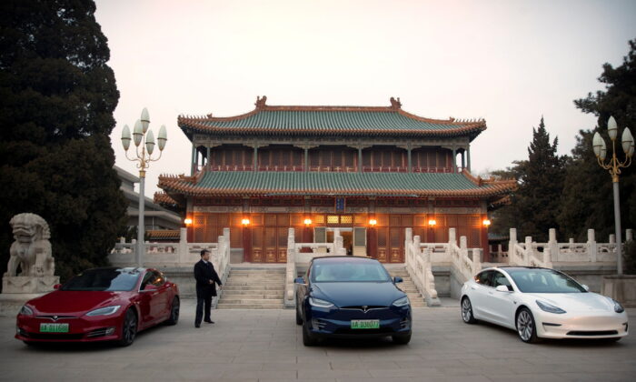 Tesla vehicles are parked outside a building at the Zhongnanhai leadership compound in Beijing on January 9, 2019. (Mark Schiefelbein/Pool via Reuters)